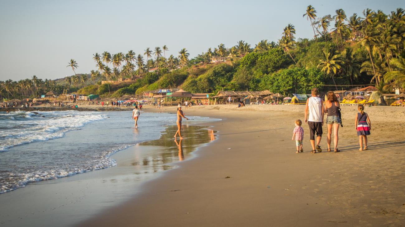 Family walking on Goa Beach